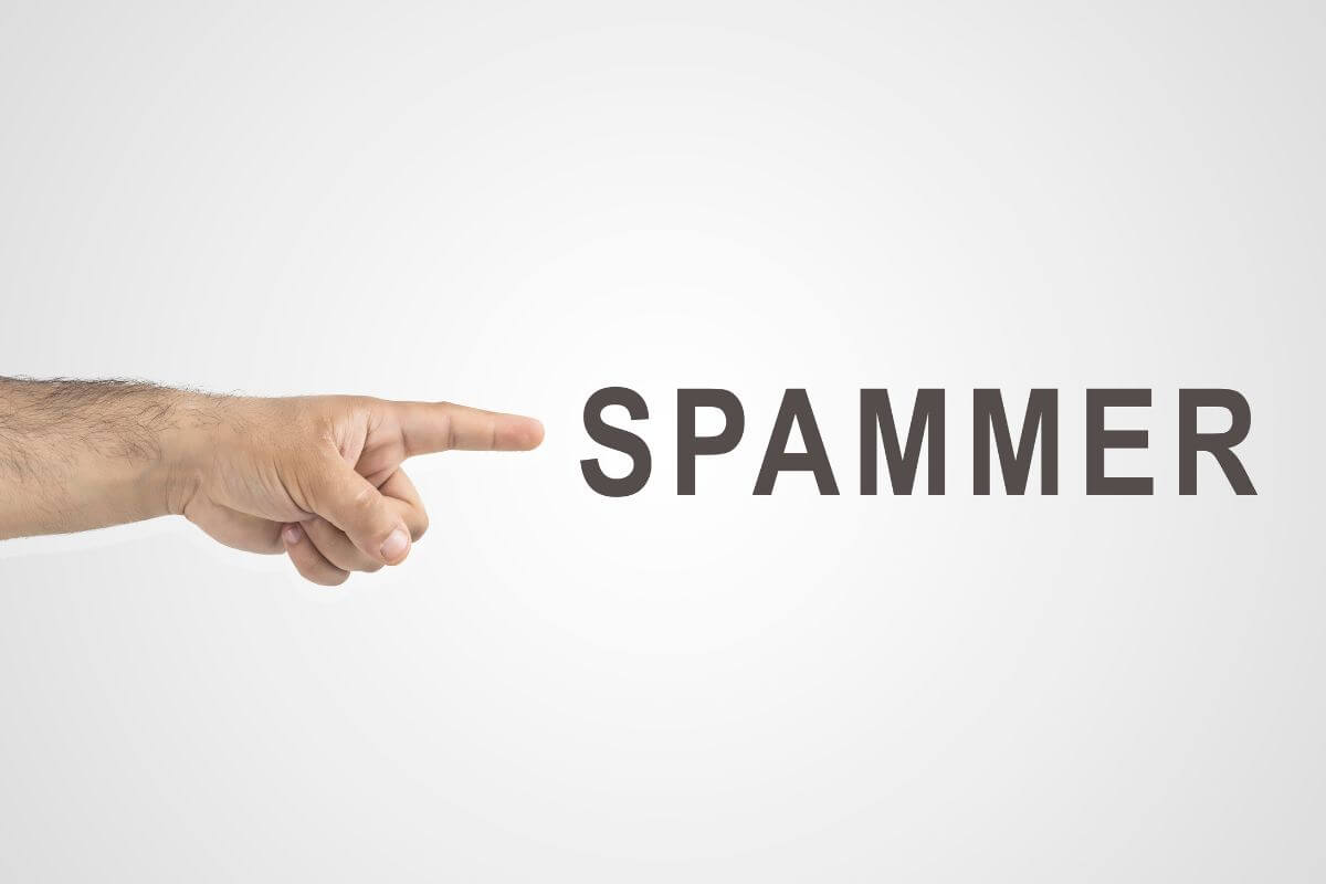 The image tells about a man's hand pointing to the letters referring to making sure they know the hassles spammers can cause to protect your parents from fraud and identity theft.