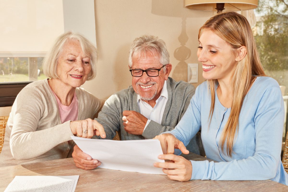 Image of a woman helping her parents with their finances.