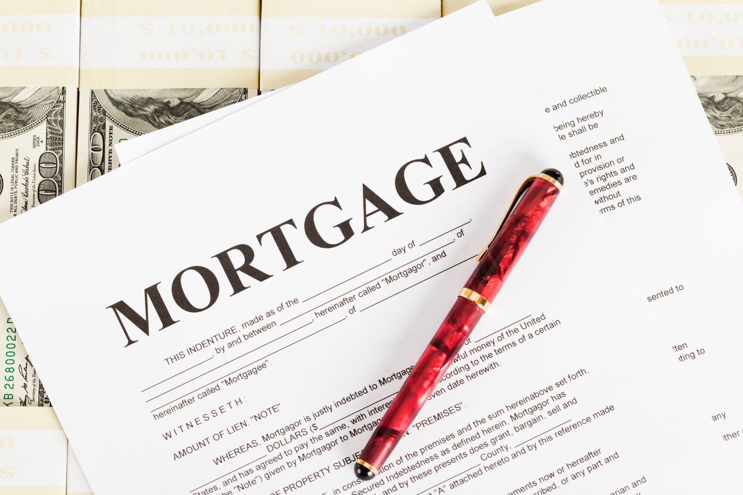 Image of a pen and paper with mortgage wording.