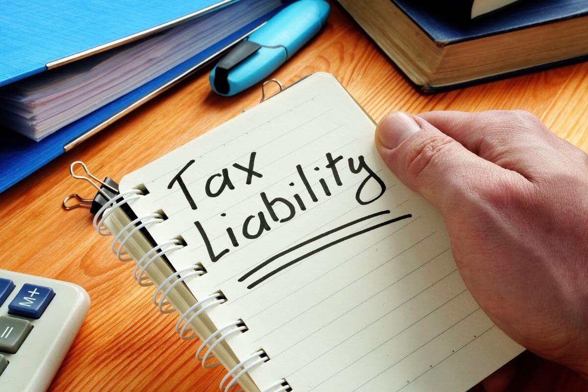 The images show a book, a marker, papers, a calculator, and a man's hand holding a notebook with notes indicating that outstanding tax liabilities can lead to penalties, settling tax debt early keeps your finances secured.