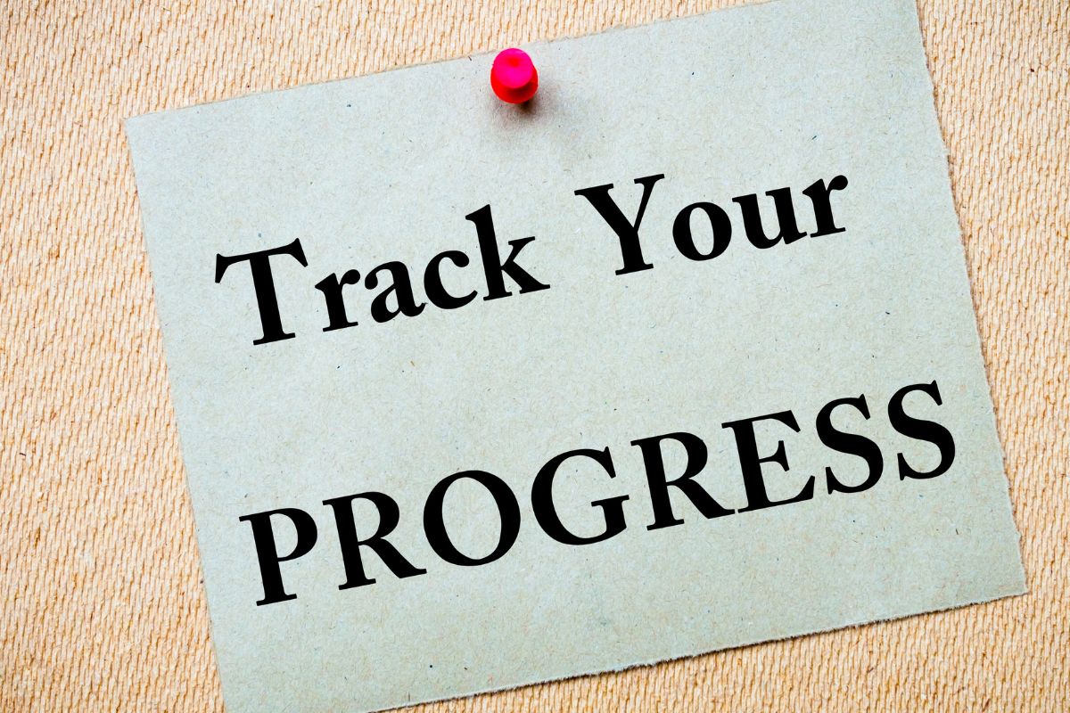 The photo shows a paper with track your progress wording.