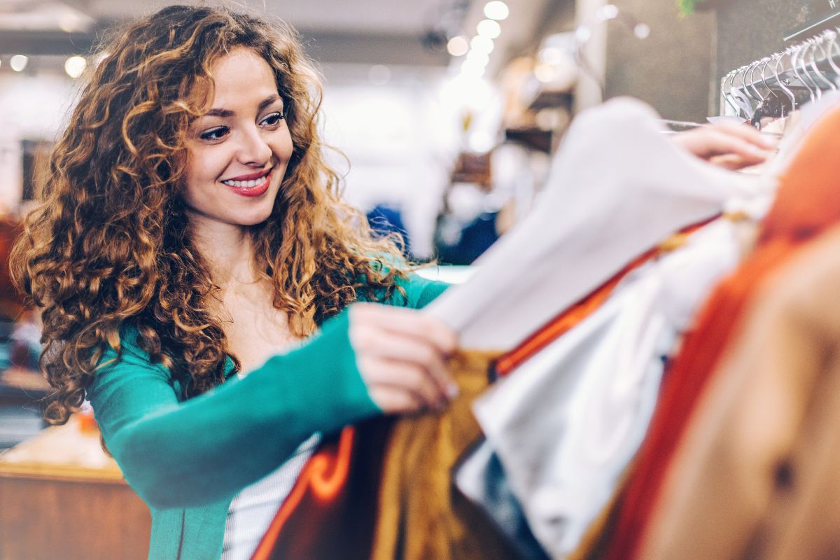 Picture of a woman shopping for clothes.