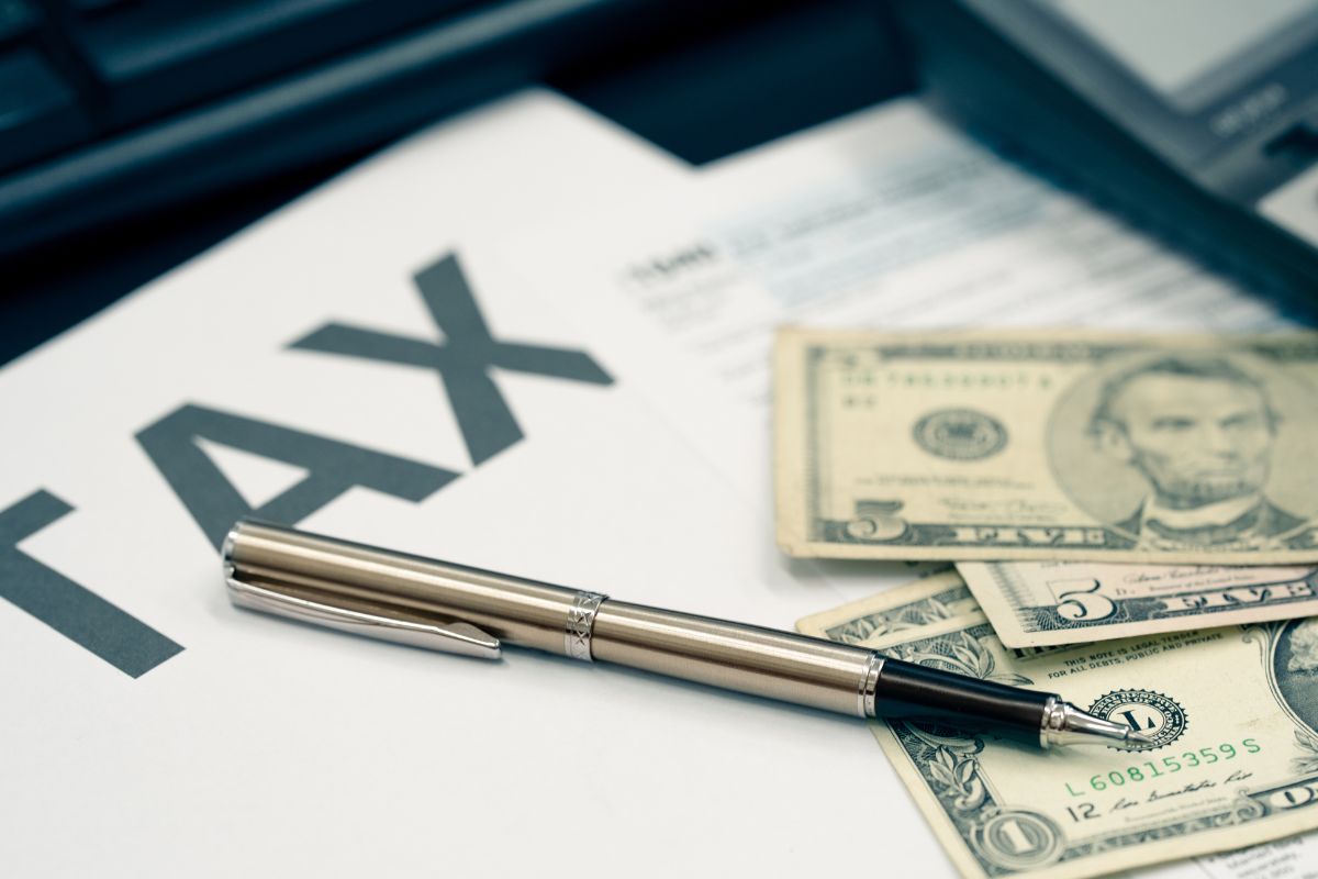 Photo of money and tax forms.