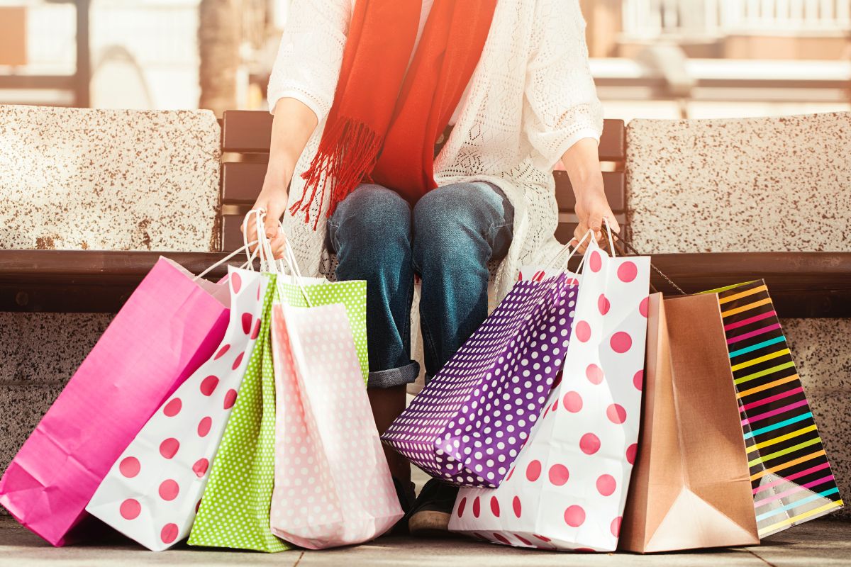 The photo of a woman with shopping bags.