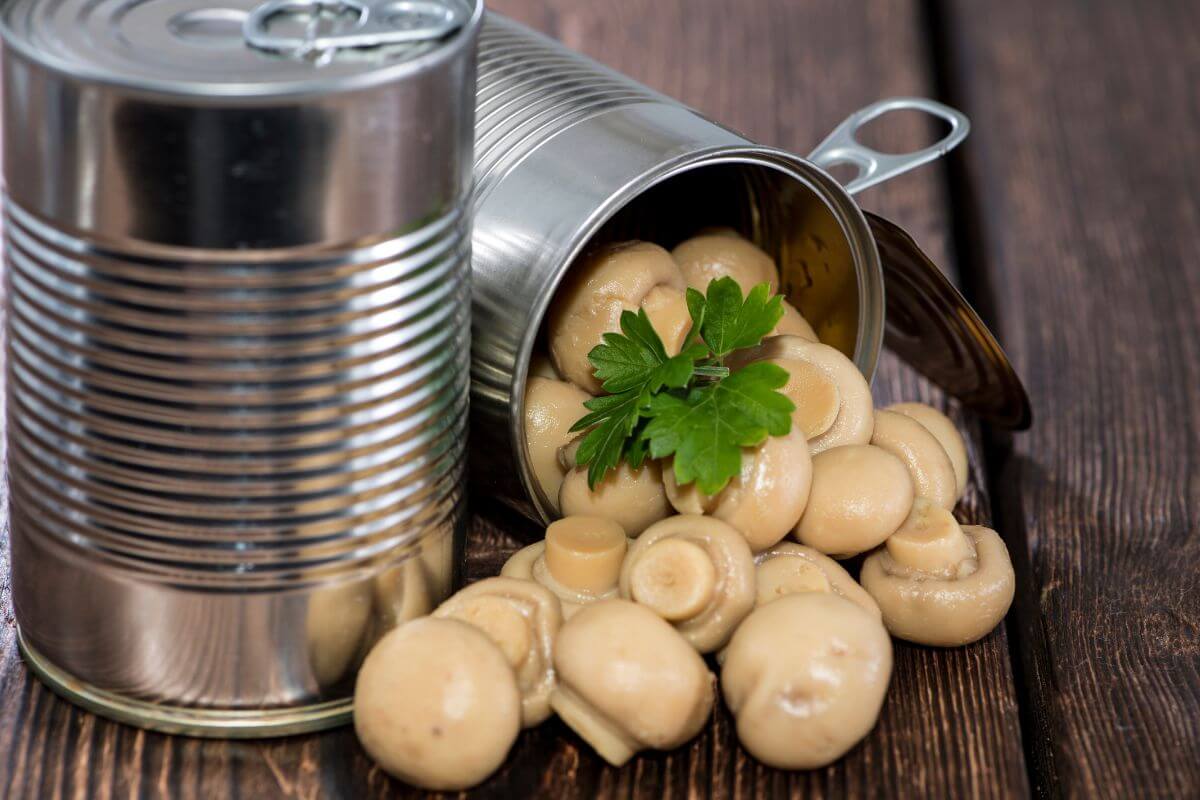 The image tells about canned mushrooms referring to they cost less than fresh mushrooms and last much longer.