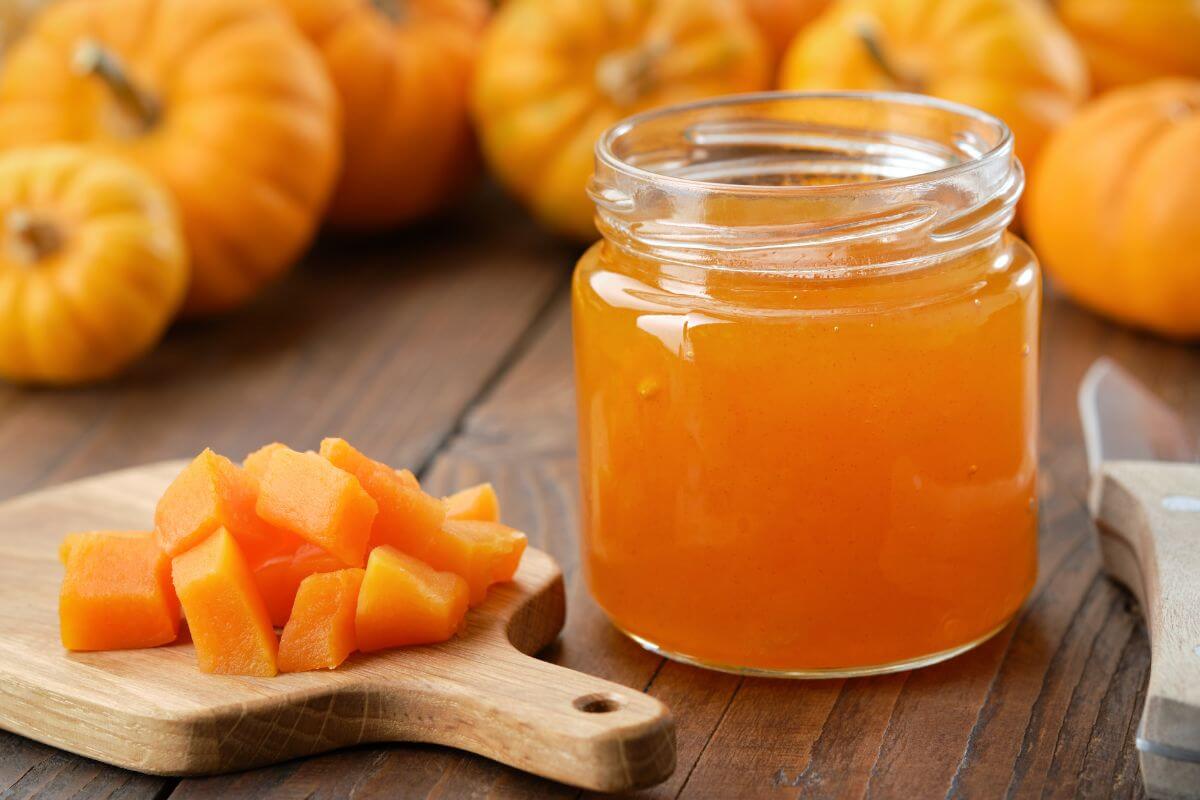 The image tells fresh pumpkins, sliced pumpkins, and a jar with pumpkin water indicating to can add nutrition to meals without a lot of extra cost.