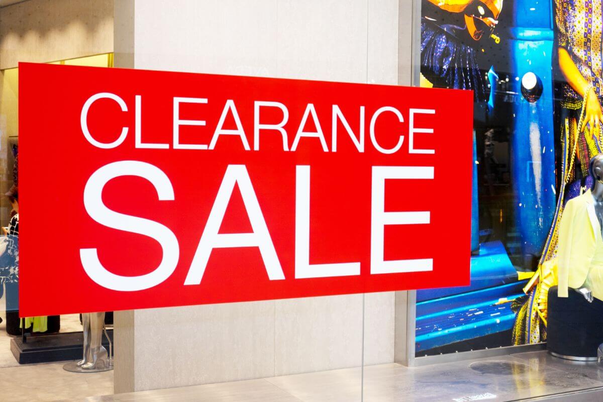 The image shows red signage with notes at the store indicating that shopping post-Valentine's clearance is an easy trick to save money without sacrificing quality.