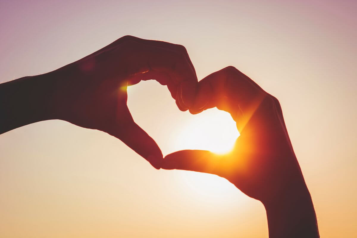 The picture shows a heart-formed shape hand which means to remind yourself that love isn't measured by price tags and thoughtful gestures often matter more than expensive presents.