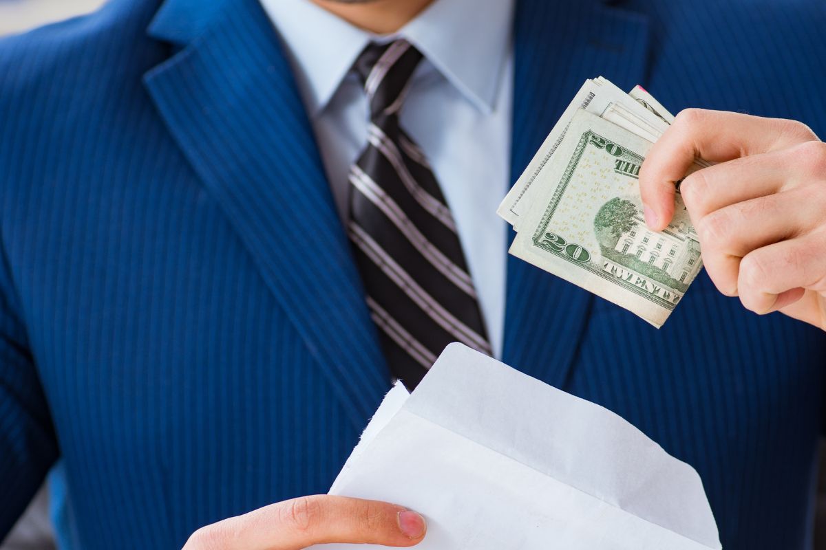 Image of a man showing his salary.