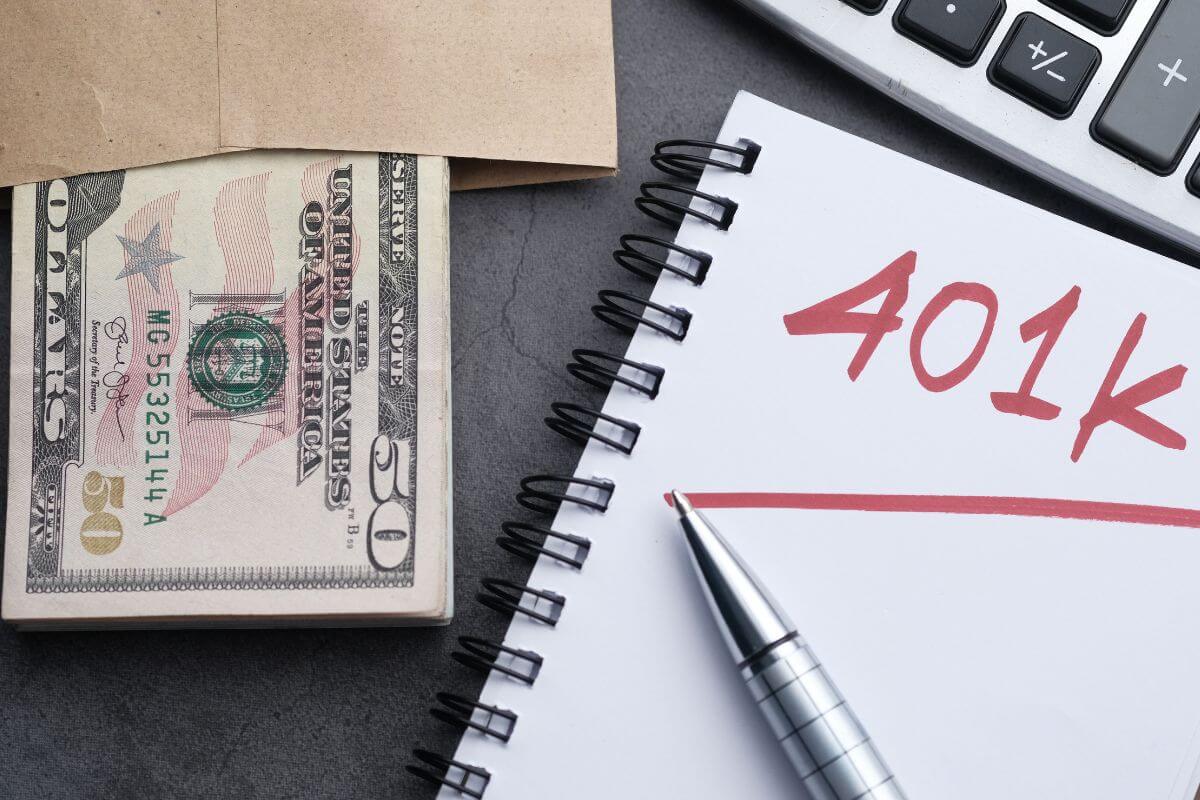 The image shows a calculator, a pen, a notebook with a note, and an envelope with dollar bills which means max out employer 401(k) match to boost retirement savings without extra effort.