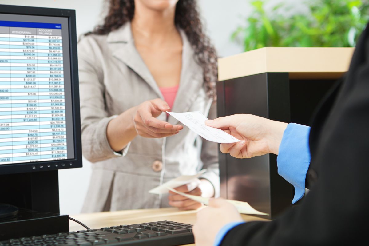 Image of a woman checking on her bank fees.