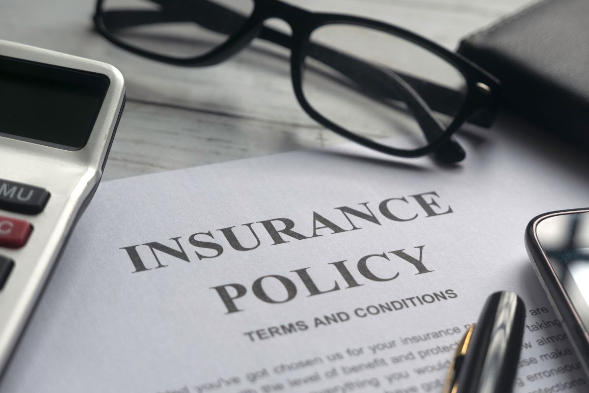 Picture of a paper with insurance policy wording.