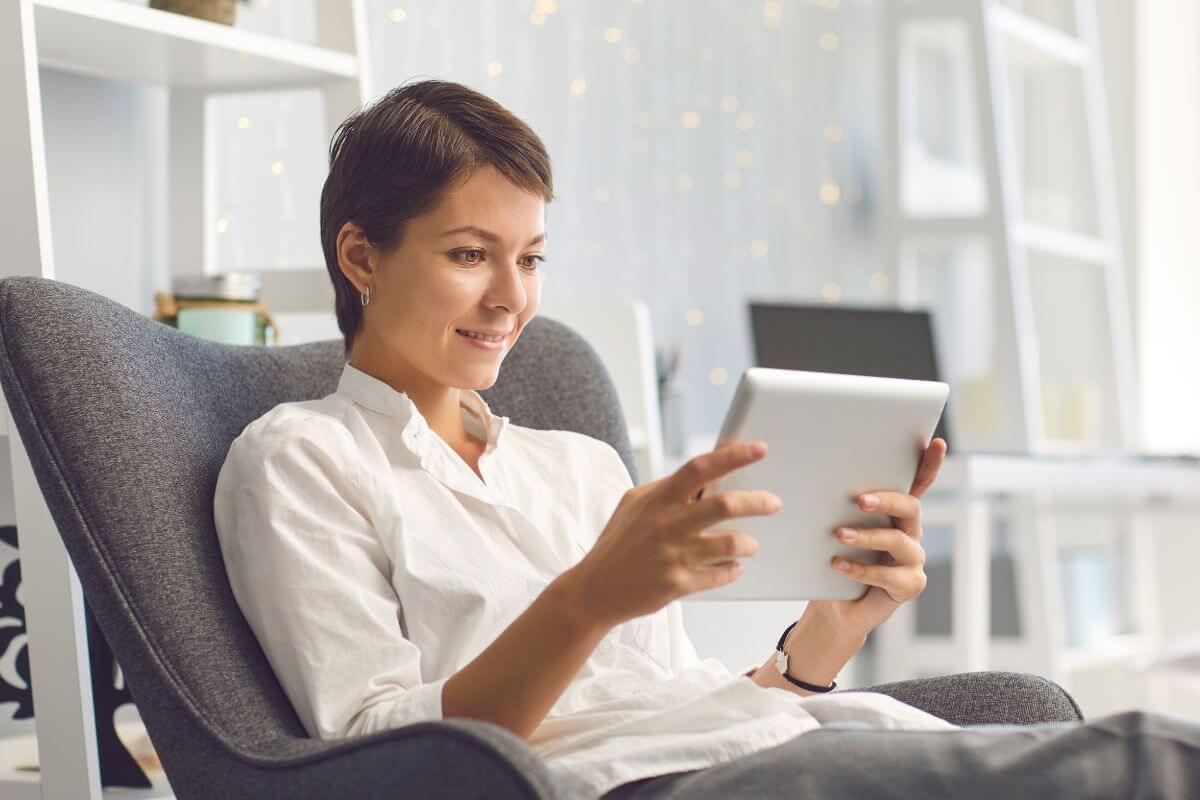 Photo of a woman using subscription services.