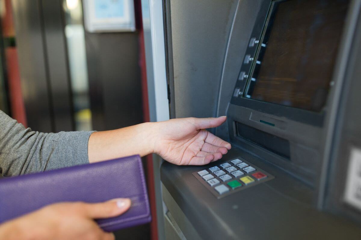 Photo of a woman withdrawing money.