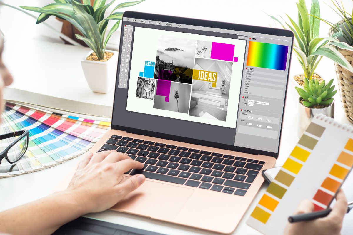 The photo shows a woman working on a graphic design.