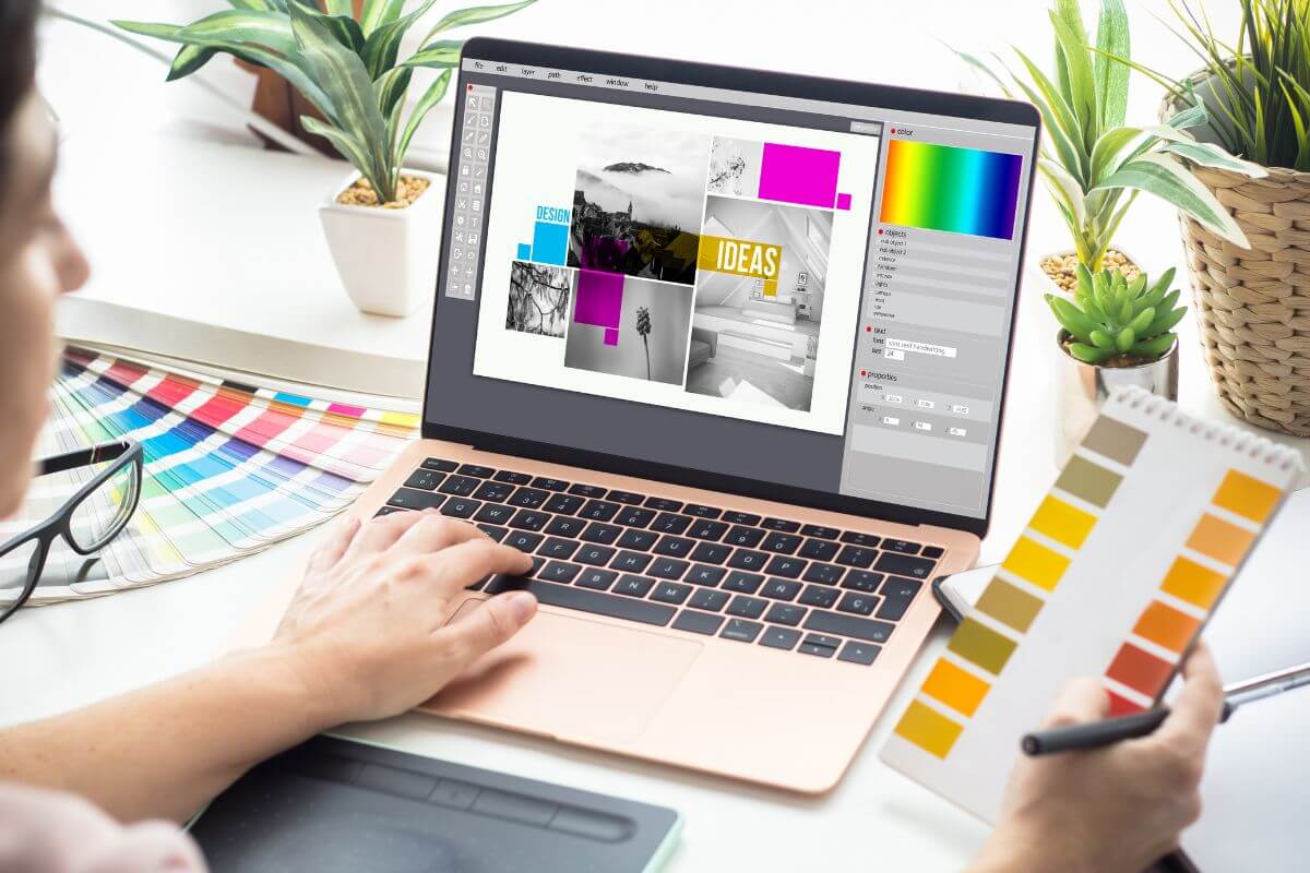 The photo tells about plants, color analysis, and a girl using a laptop with a screen display while holding a notebook with colors to choose referring to turn hobbies into income streams that can help build retirement savings faster.