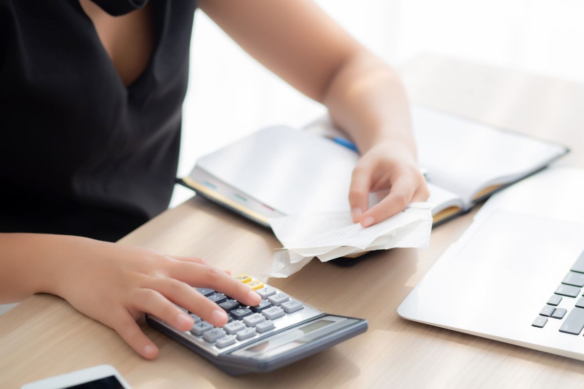 Image of a woman cutting expenses.