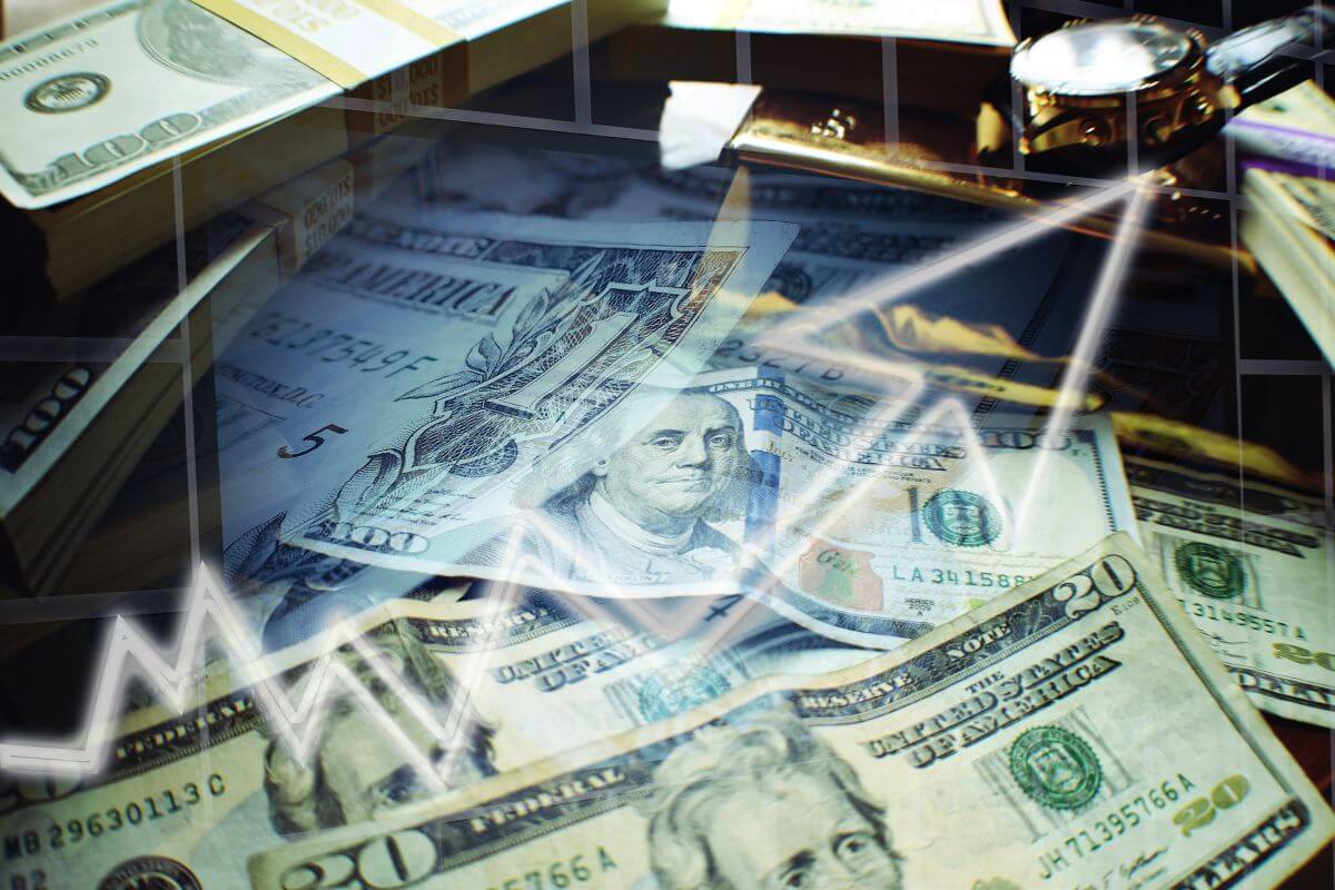The image shows dollar bills and an arrow referring to reaching a net worth milestone and becoming financially independent together.
