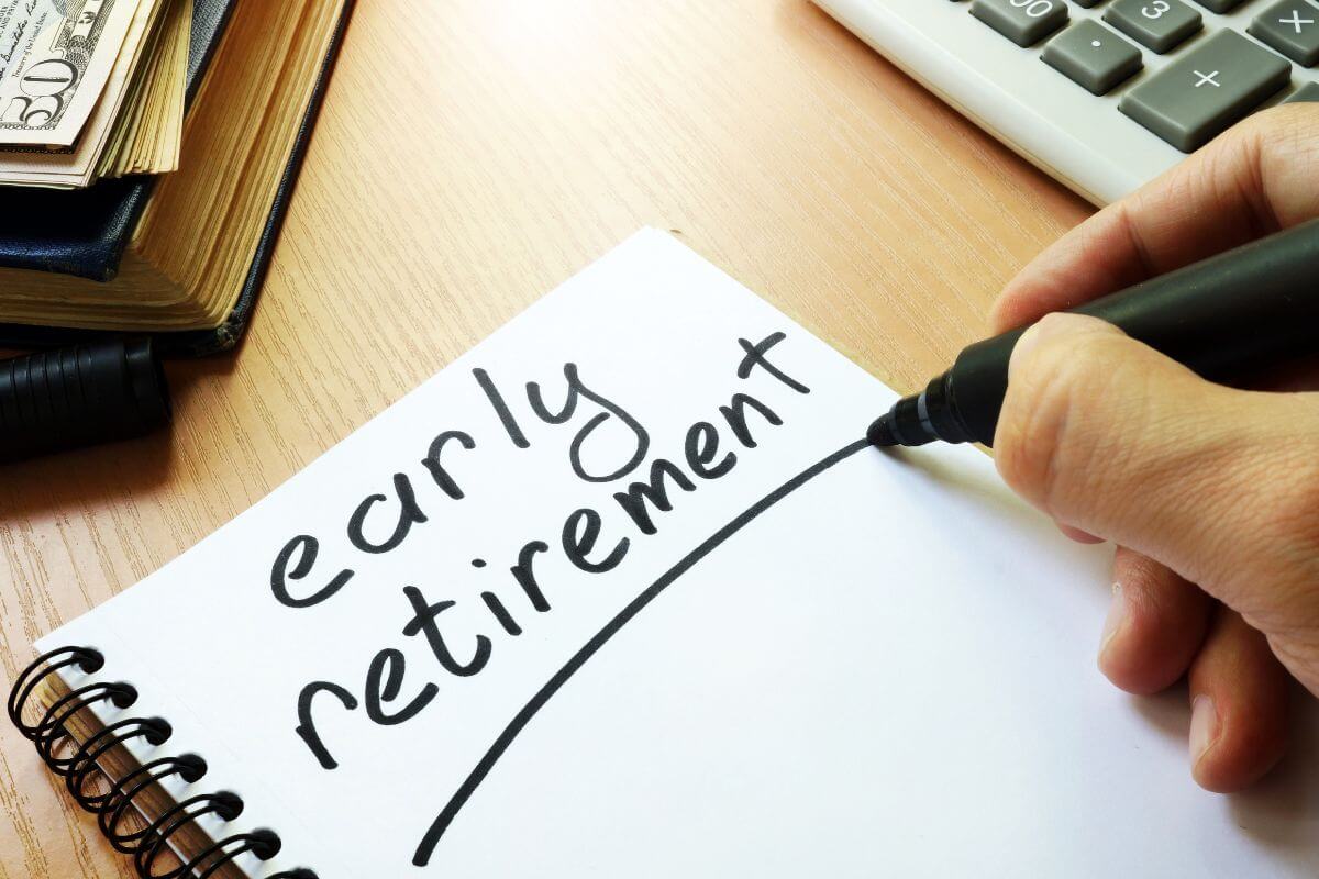 The image shows a calculator, a book, dollar bills, and a man's hand and writing on the notebook which means achieving early retirement, avoiding overspending, and building a habit of budgeting helps to add up on retirement savings.