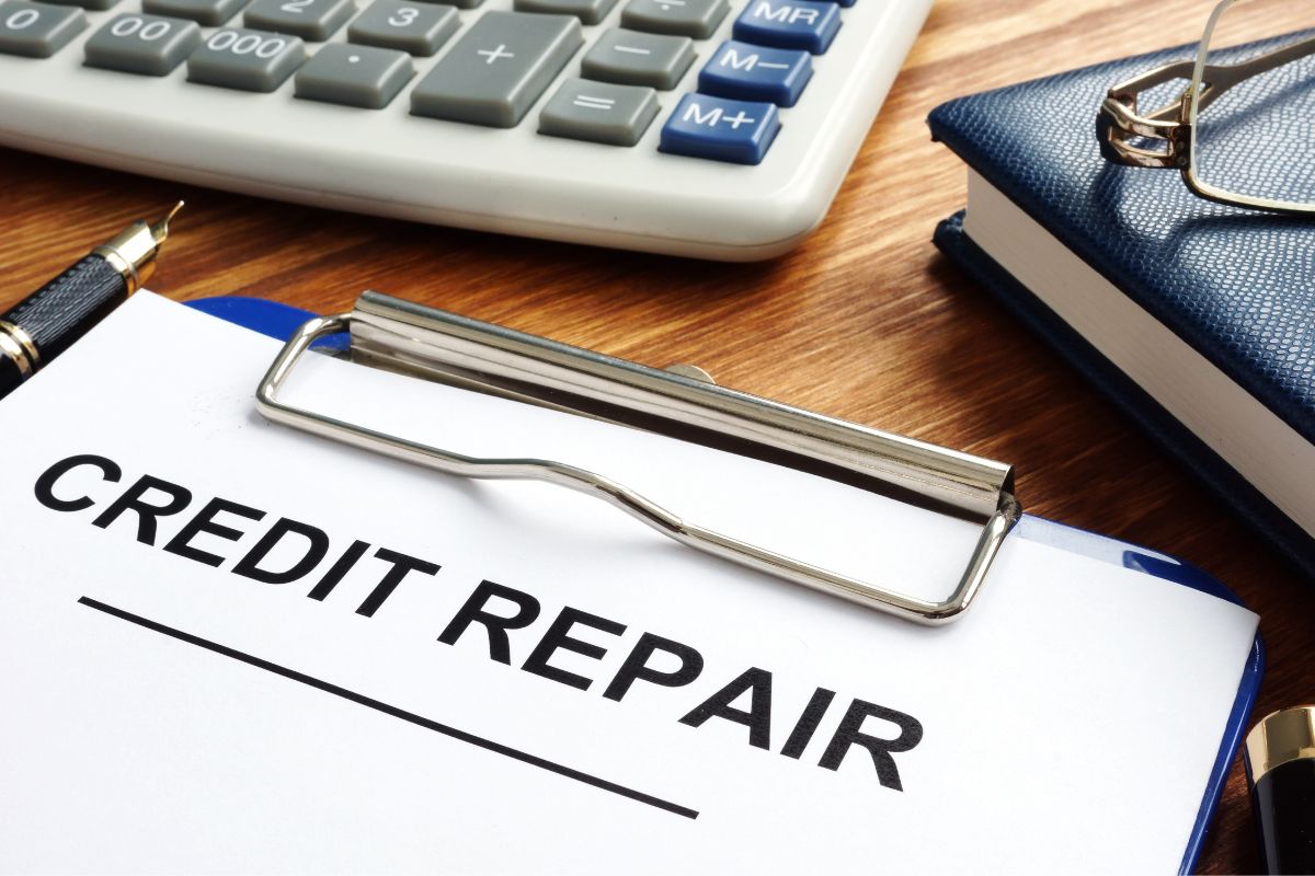 The photo shows a paper with credit repair wording.
