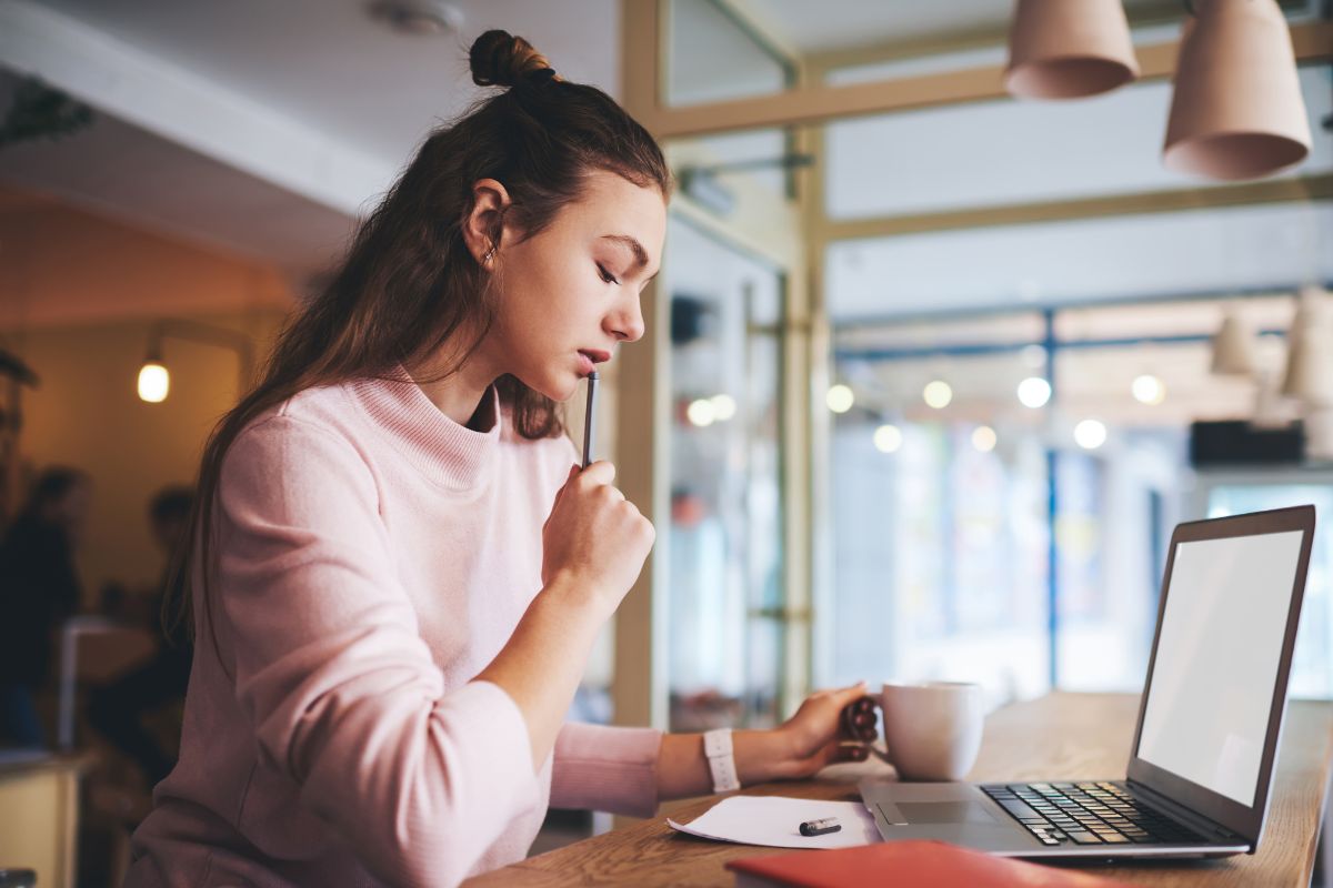 The photo of a woman reviewing her income thresholds.