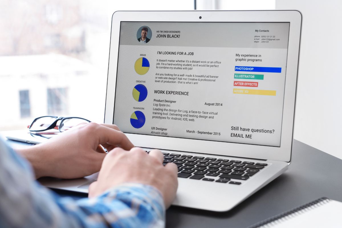 An image of a man's hand making an infographic resume.