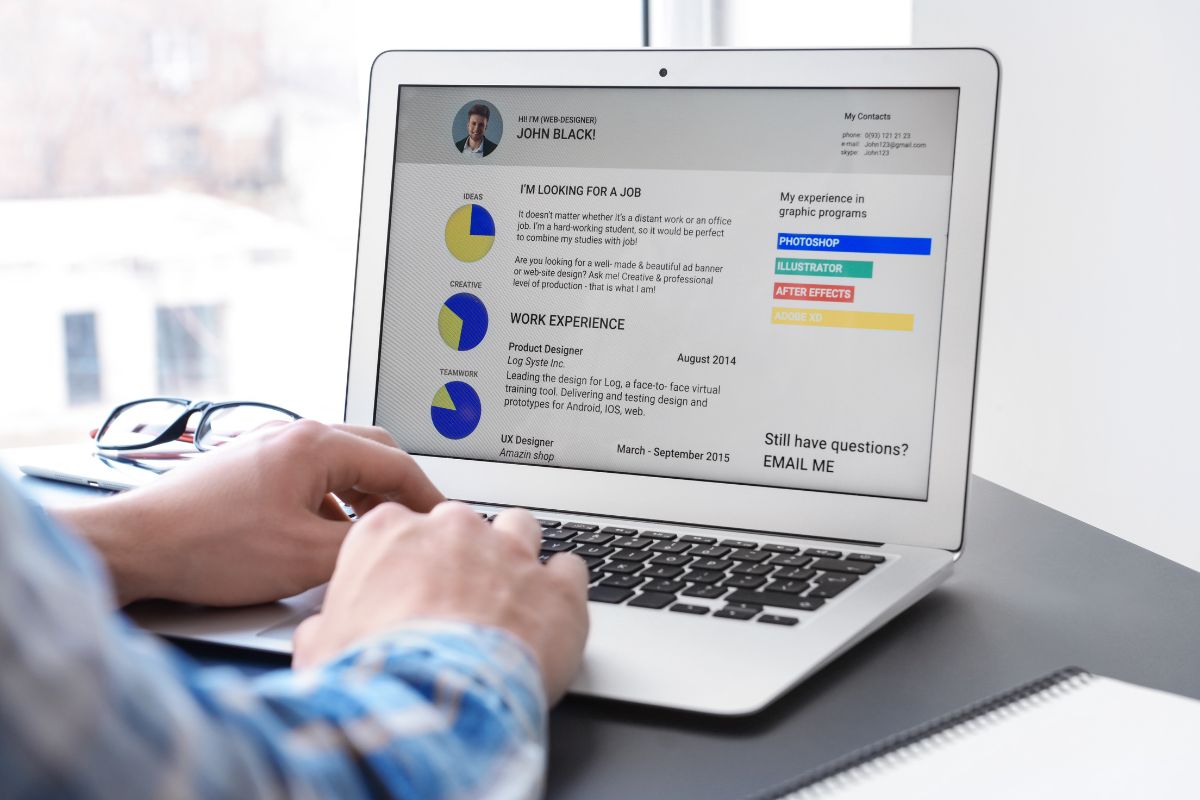 The photo tells about a man's hand using a laptop with a screen display indicating to experiment with non-tradition formats that can grab attention and leave a lasting impression.