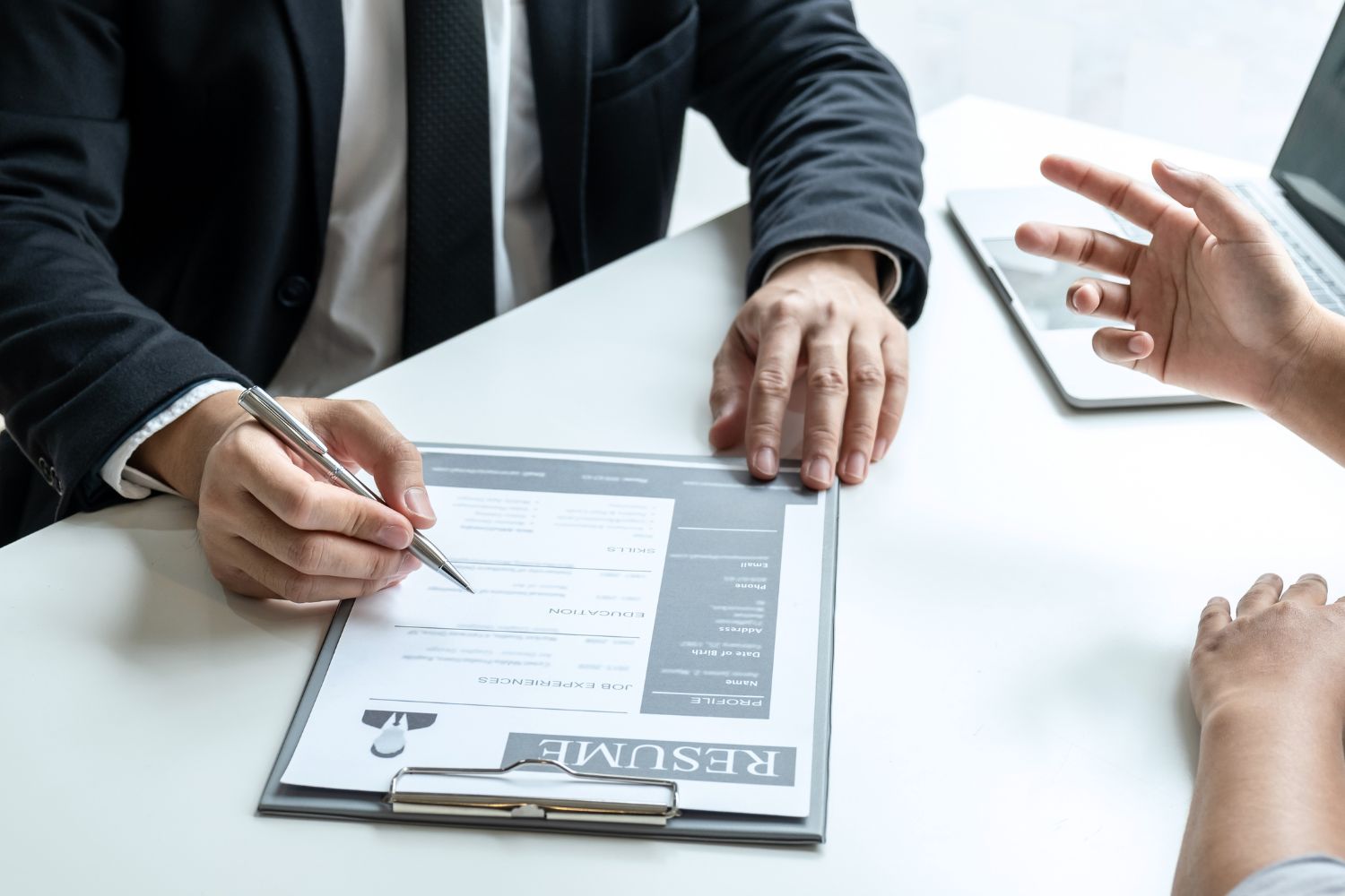 Photo of the employer doing an interview on the applicant.