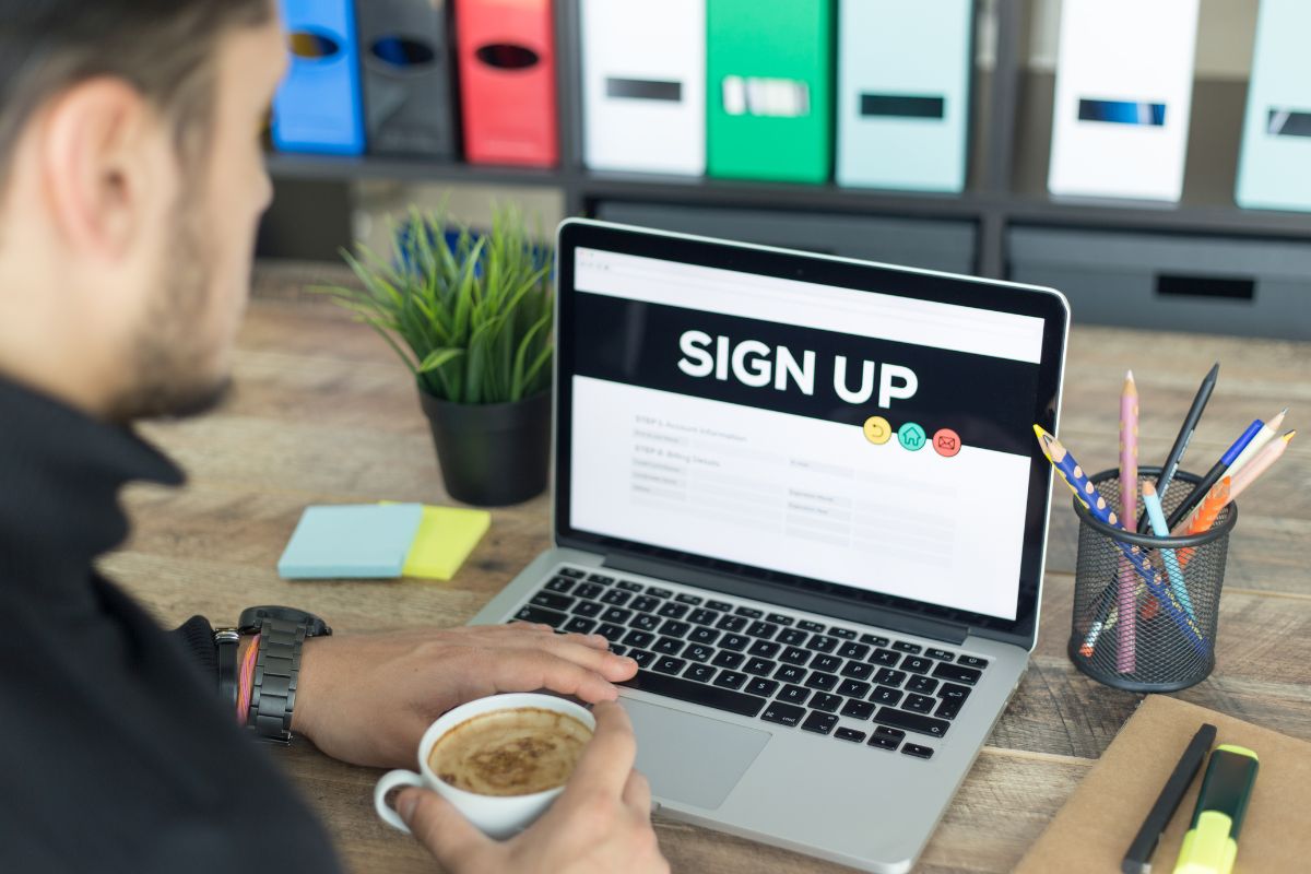 Picture of a man signing up.