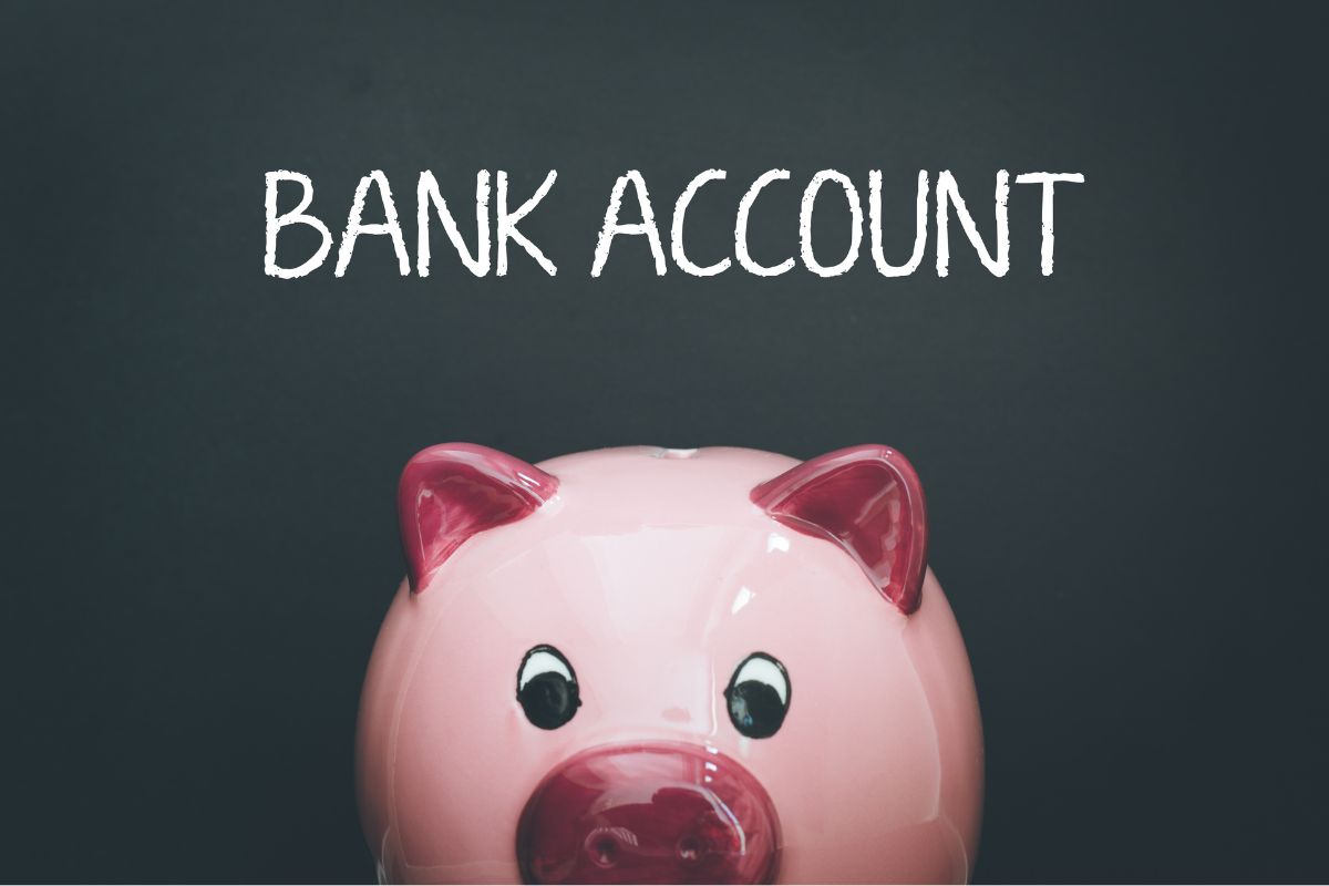 Photo of a piggy bank and a bank account wording.