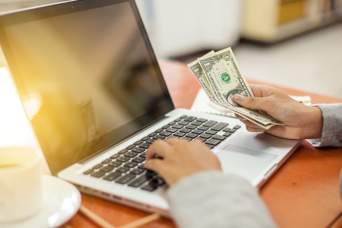 Image of a woman's hand setting up autopay.