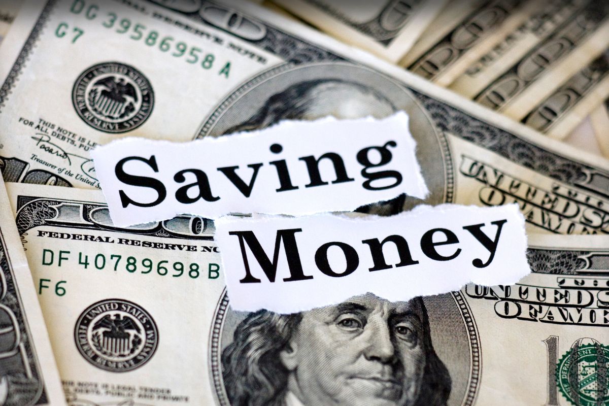The image shows money and paper with saving money wording.