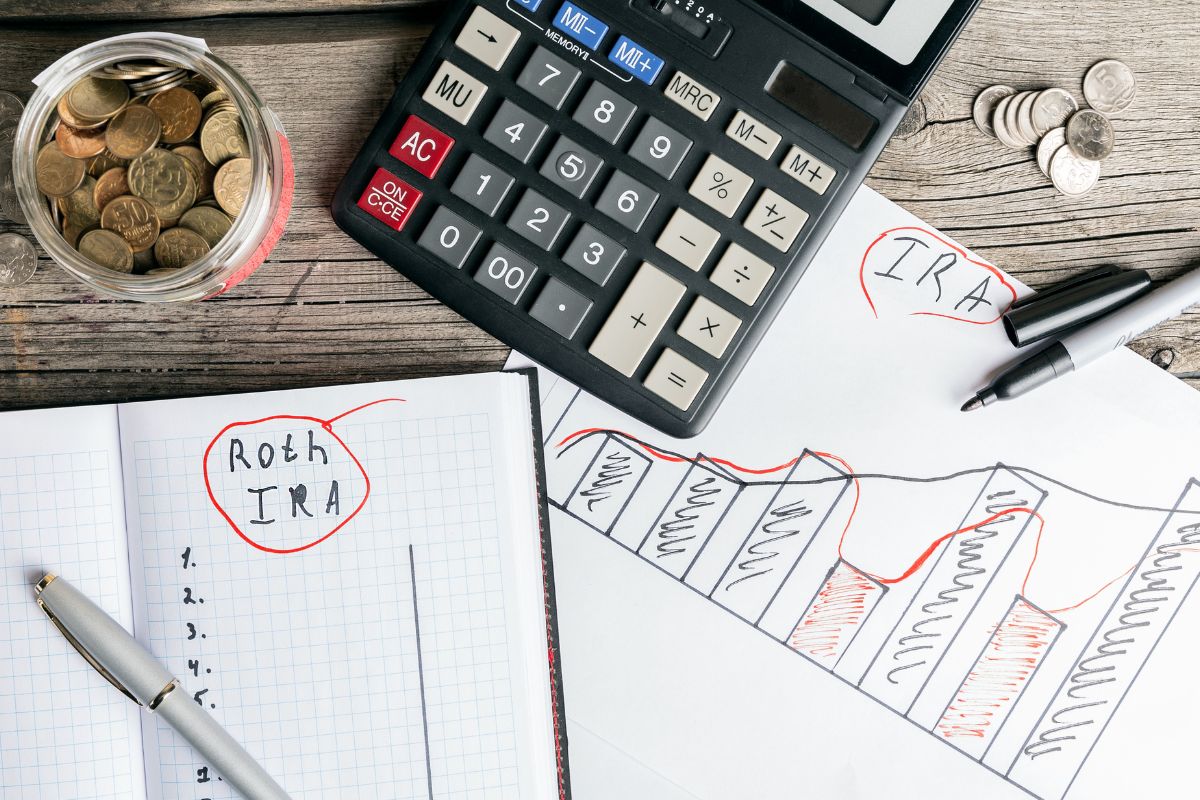 The picture tells about a calculator, a jar with coins, a pen, and notebooks with graphs and notes which means that using tax optimization strategies can save you thousands every year and help build wealth faster.