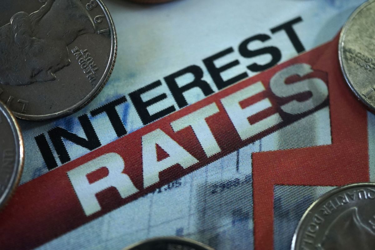 The photo shows money and interest rates wording.