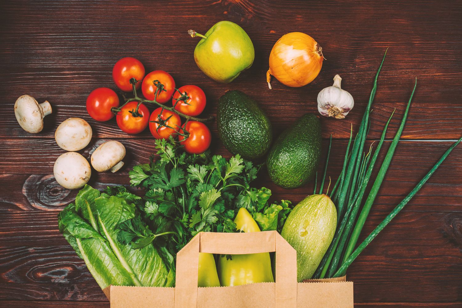 Picture shows a paper bag with vegetables.