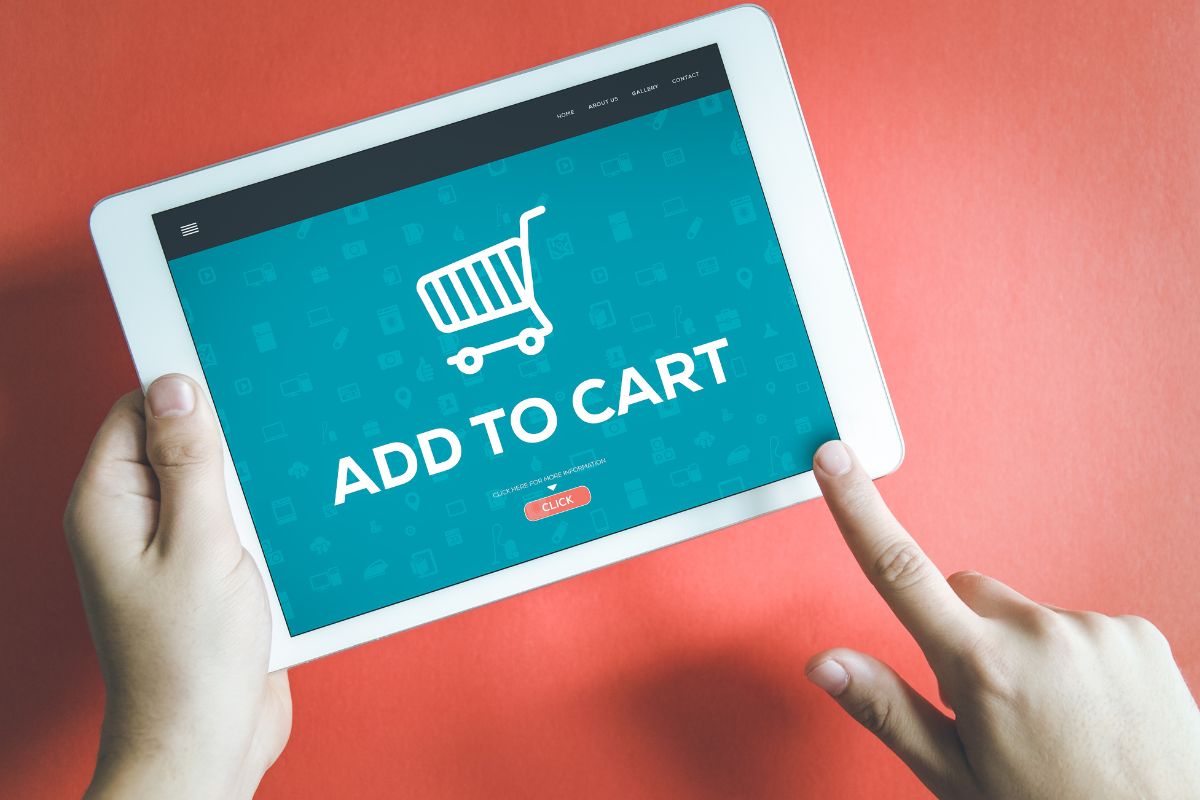The photo shows a woman's hand creating a fake shopping cart.