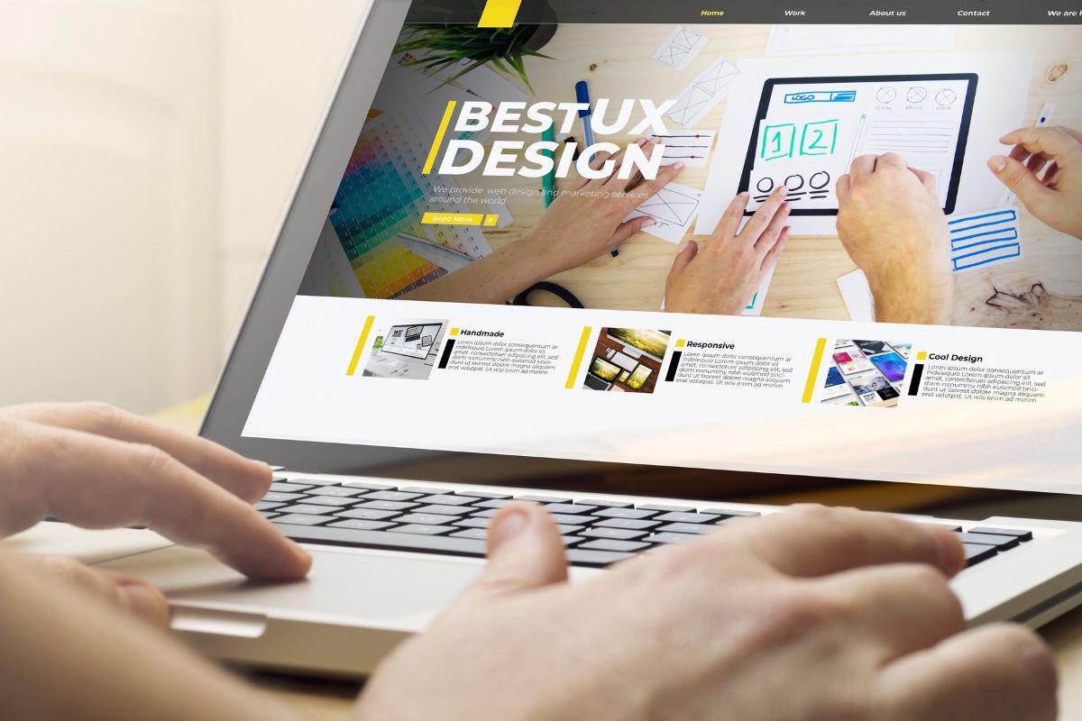 The photo shows a man's hand using a laptop referring to test website usability one of the best online side gigs since it doesn't require experience.