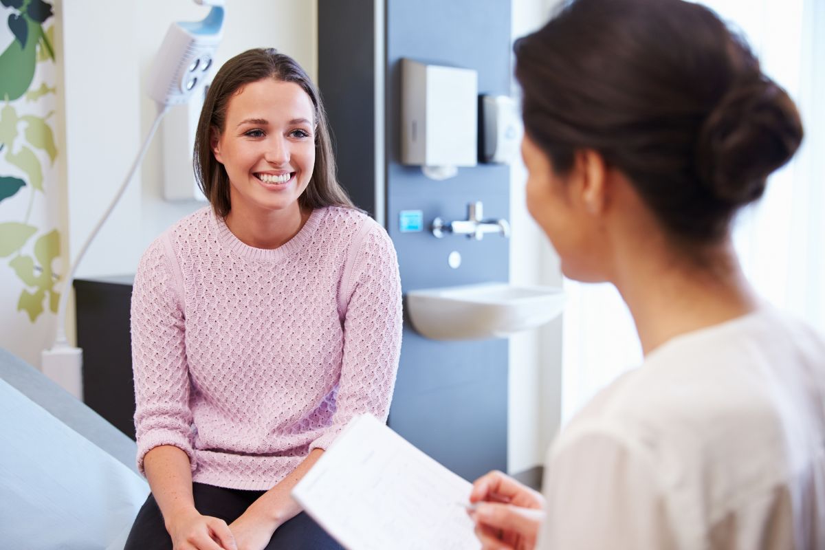 The picture shows a nurse and a patient.