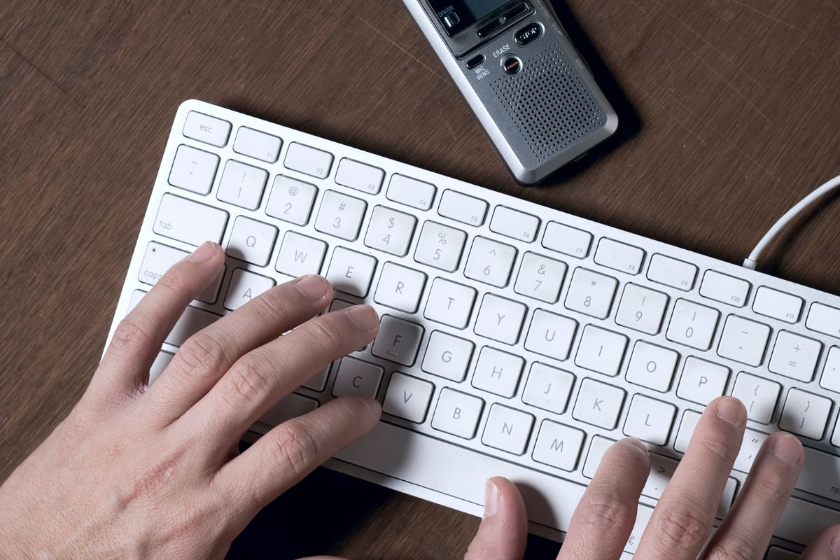 Image of a man's hand transcribing.