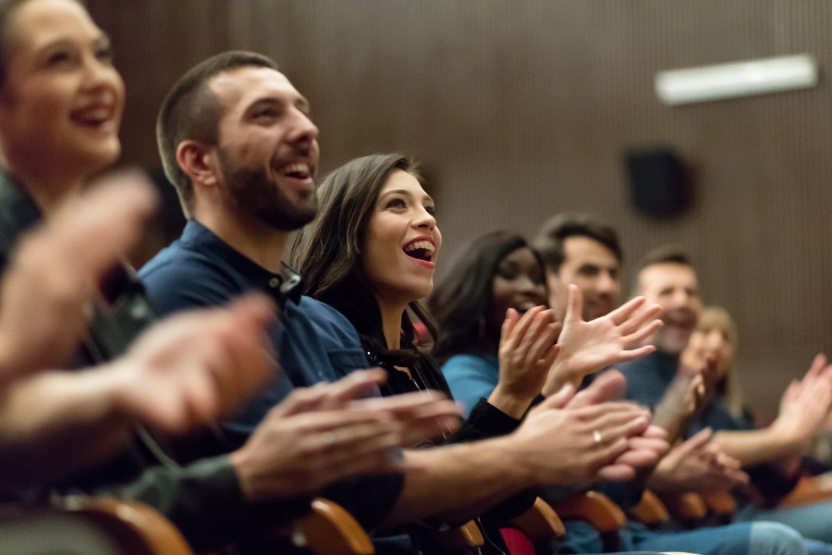 The image shows the audience at the event.
