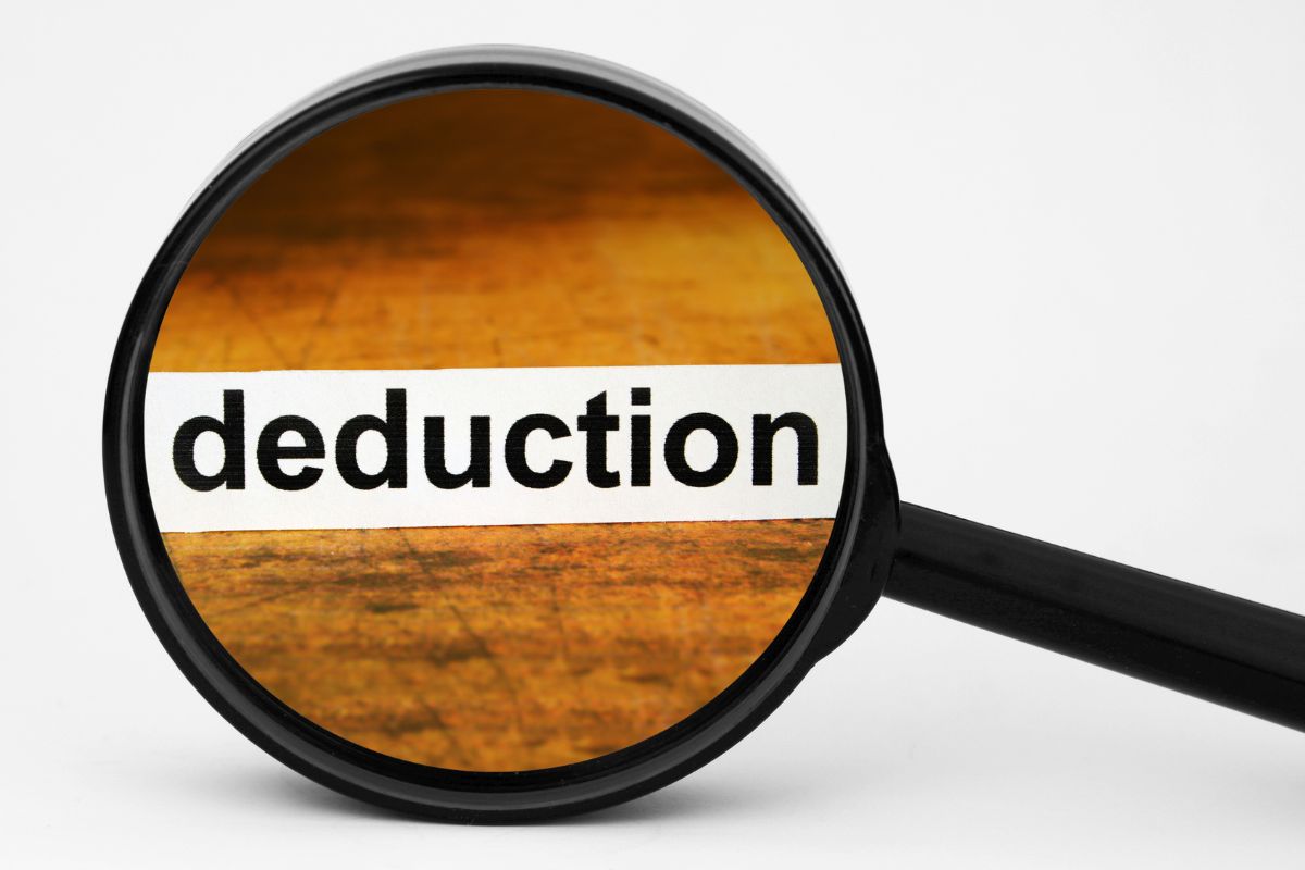 The image shows a magnifying glass with deduction wording.