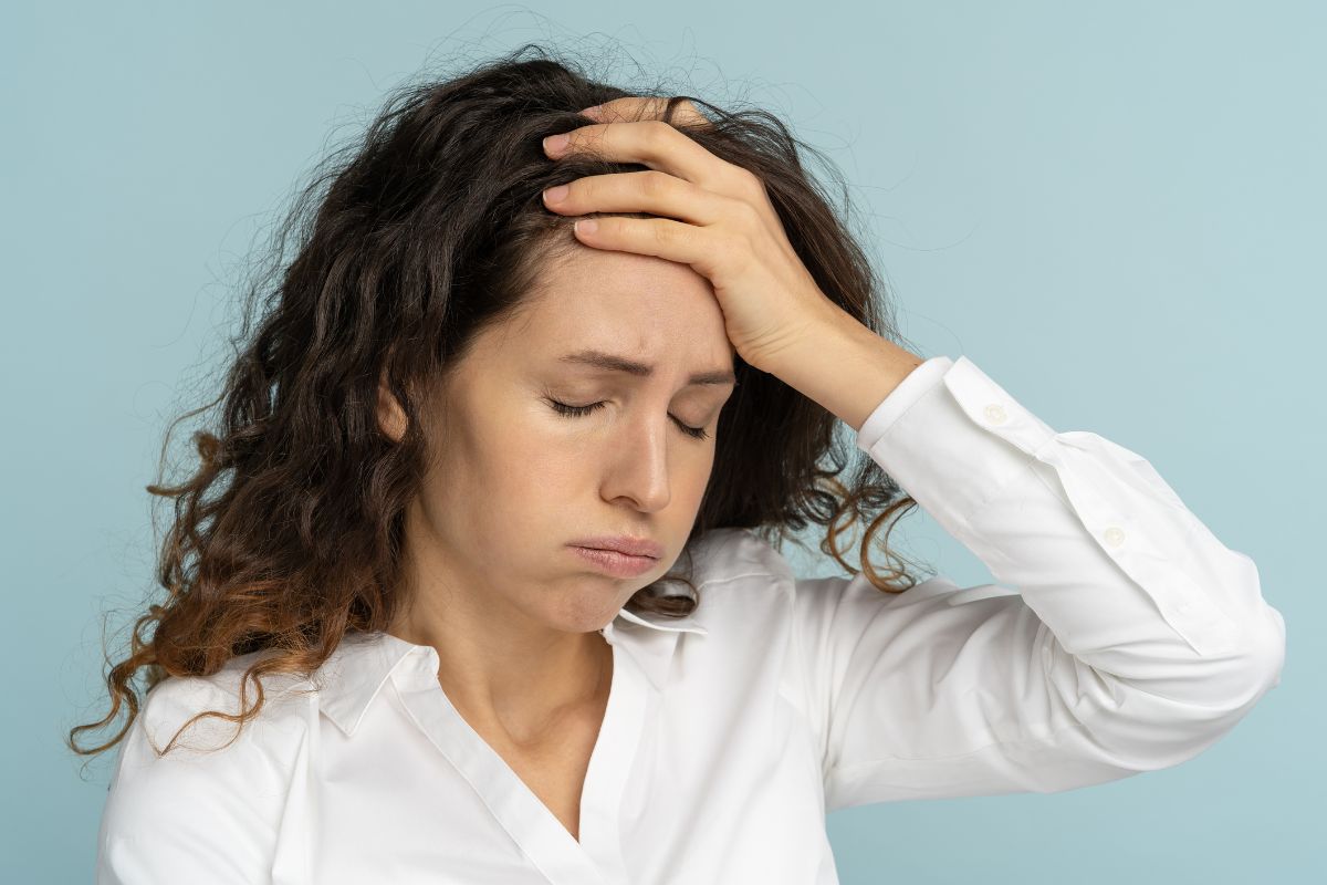 The picture shows a frustrated girl which means failing to adjust to life changes might be overpaying, a quick review each year can prevent unnecessary payments.