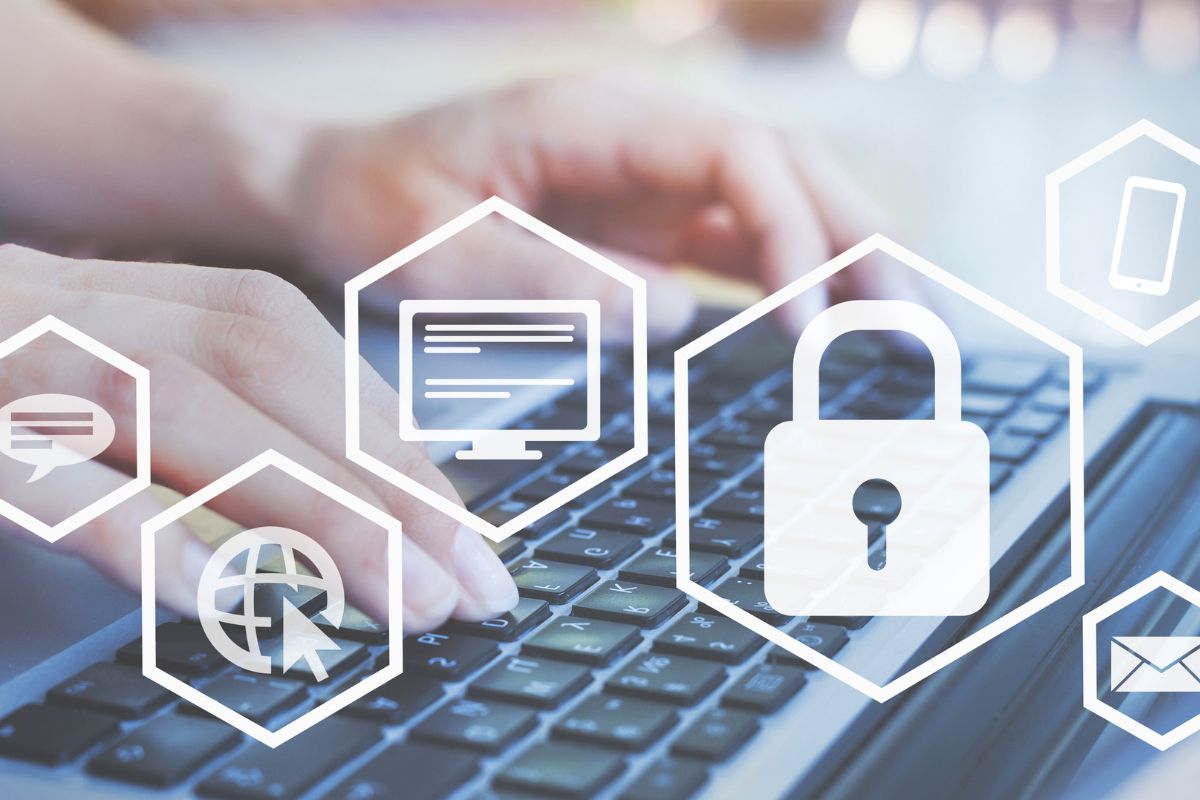 Phto shows a man's hand working on cybersecurity.