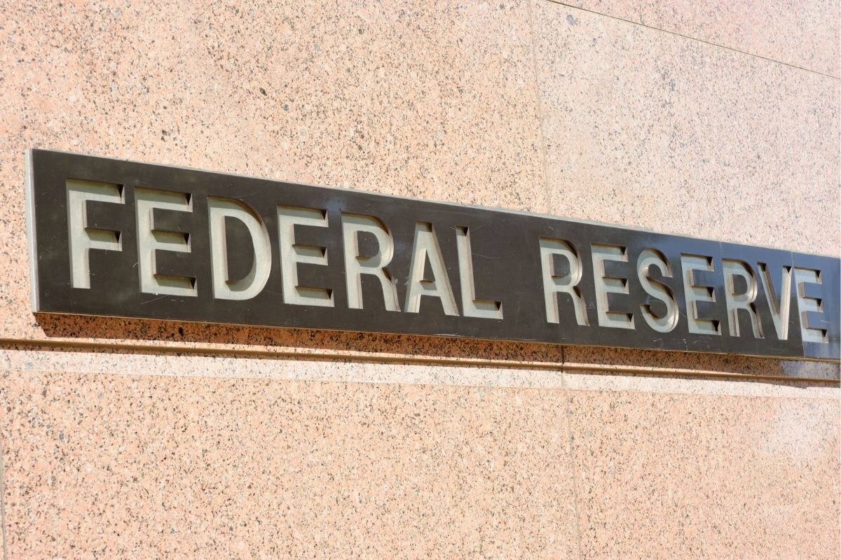 The photo shows a wall with federal reserve wording.
