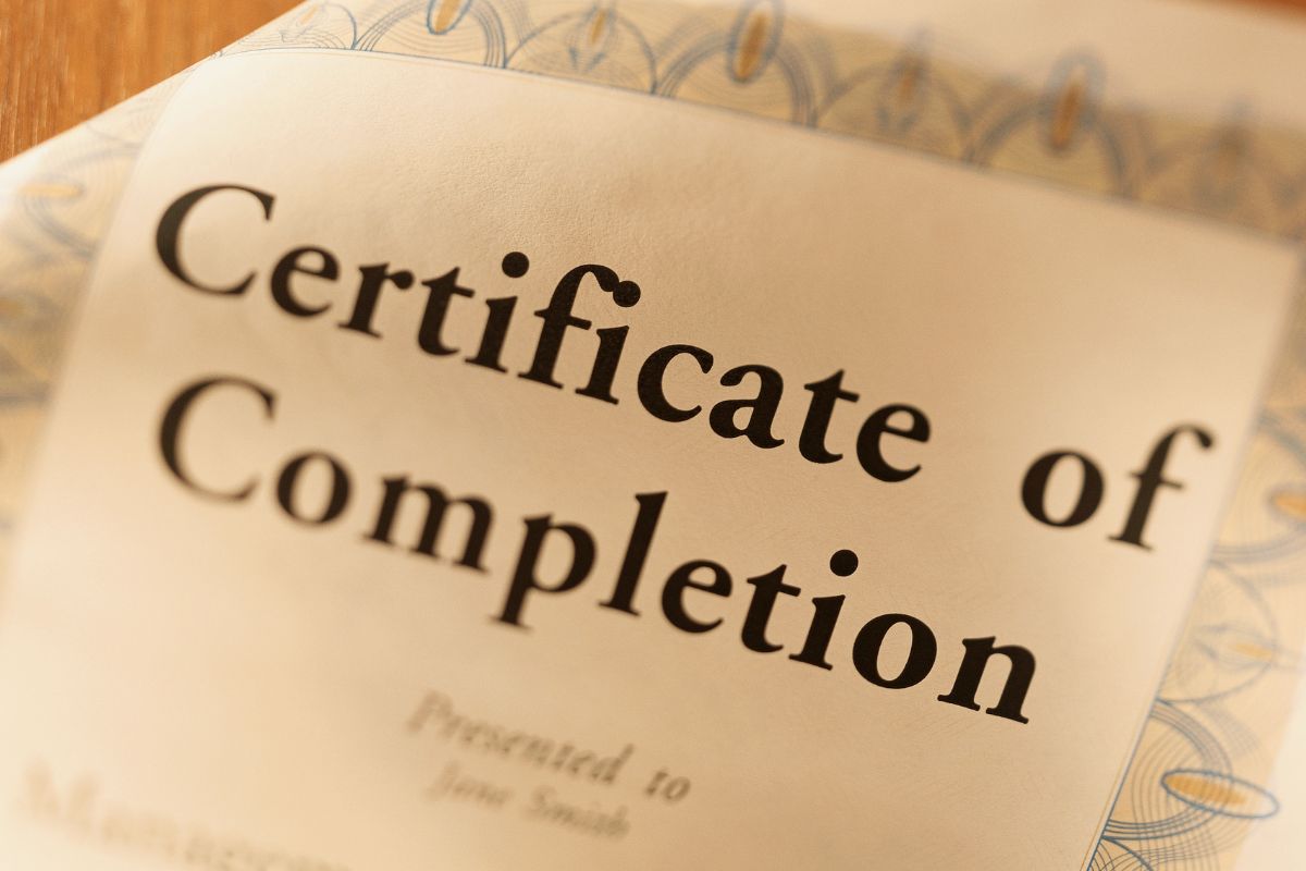 The photo of the paper with the certificate of completion.