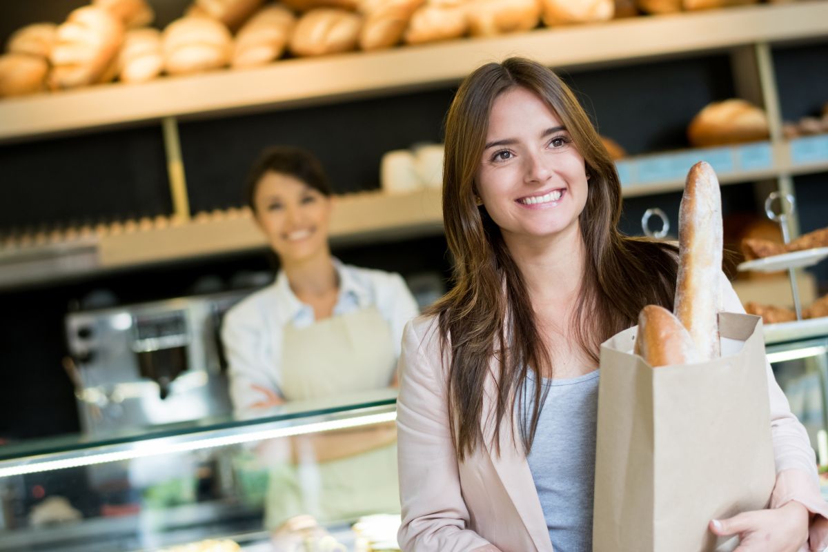 Image of a woman buying bread.