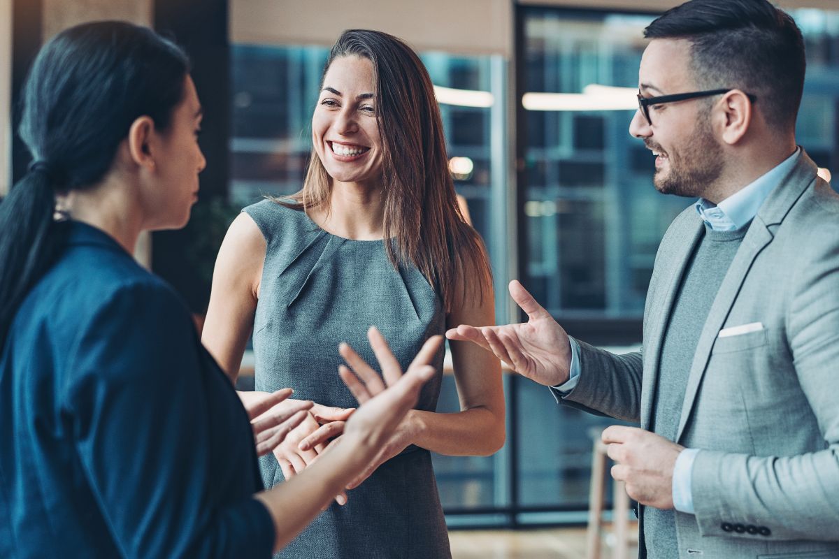 The image shows a group of people networking.