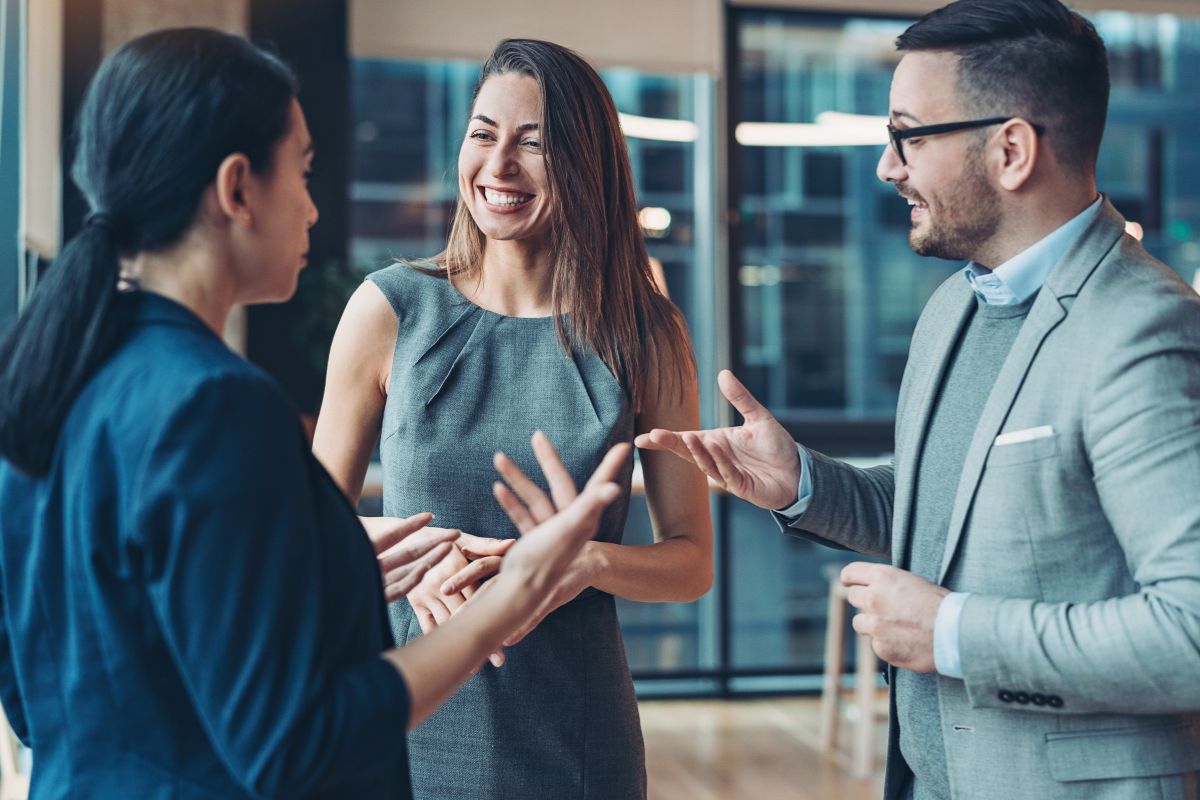 The photo tells about a group of people talking together referring to networking with other wealthy individuals makes it easier to find opportunities and stay motivated.