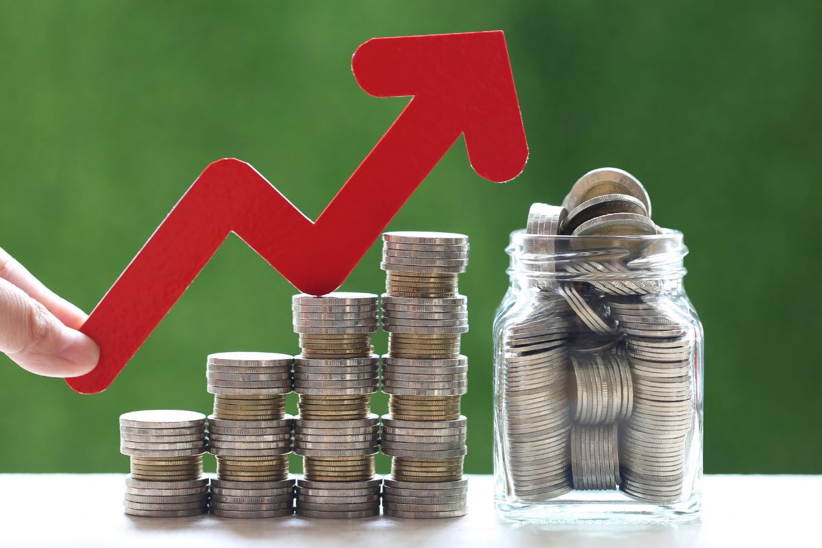 The images show coin stocks, a jar filled with notes, and a man's hand holding an arrow referring to learning new skills for financial growth helps make more money and increase income.