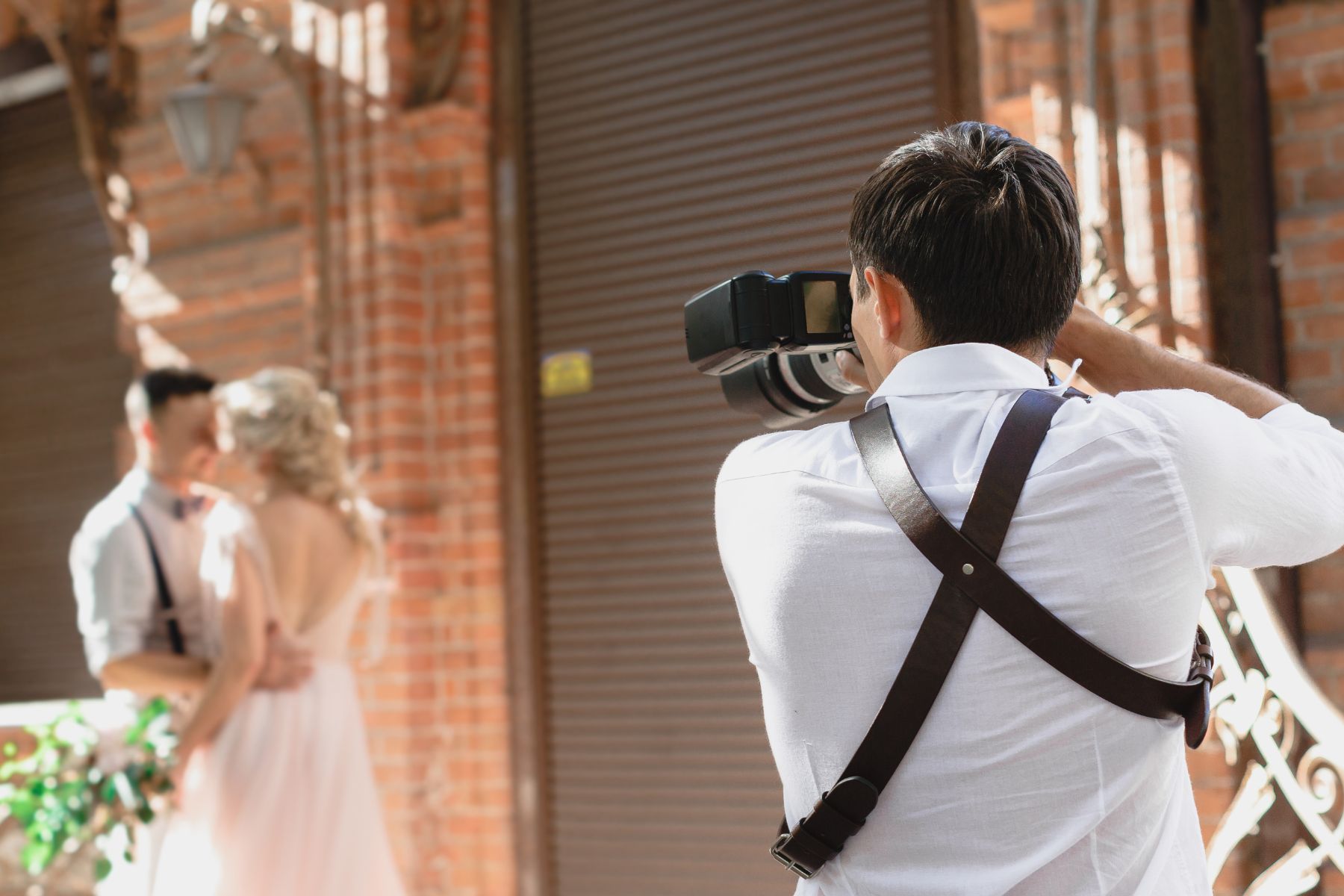 The image of the photographer taking a picture of the couple.